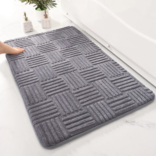Grey bath mat with tufted basketweave