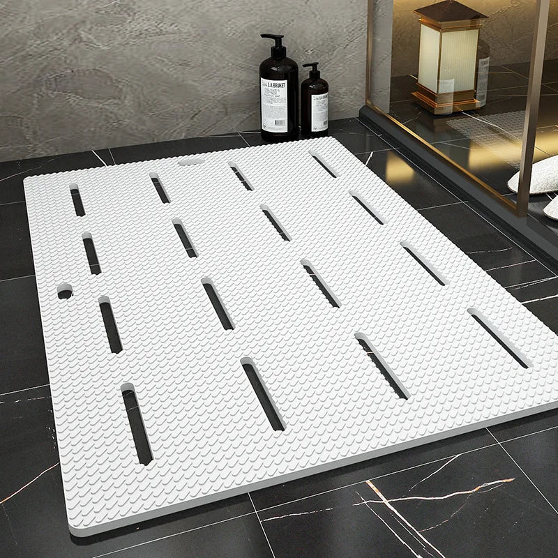 White shower mat with drainage slots