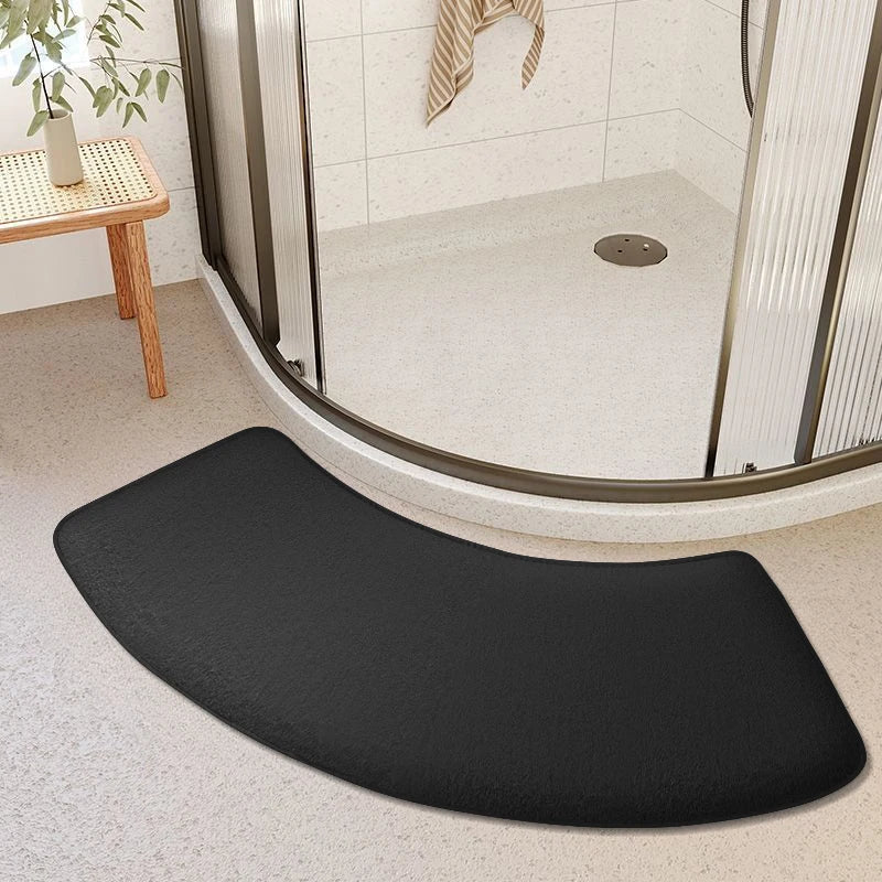 Black curved bath mat