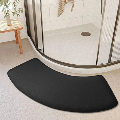 Black curved bath mat