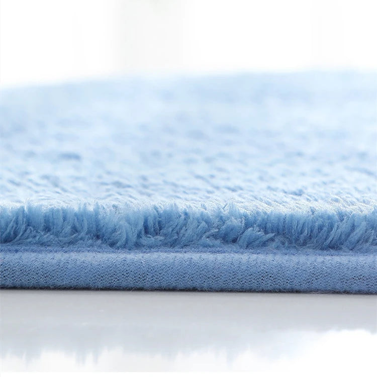 Blue bath mat with soft plush