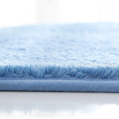 Blue bath mat with soft plush