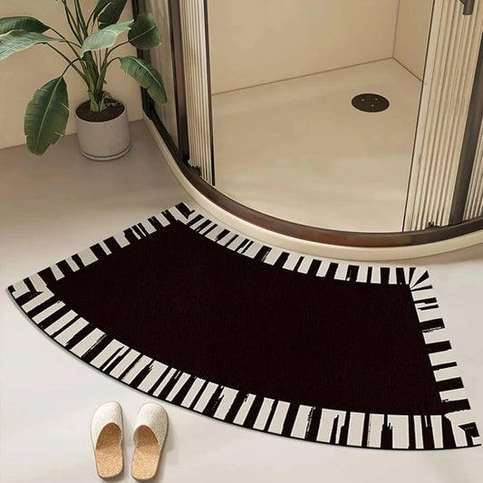 Curved black and white bath mat